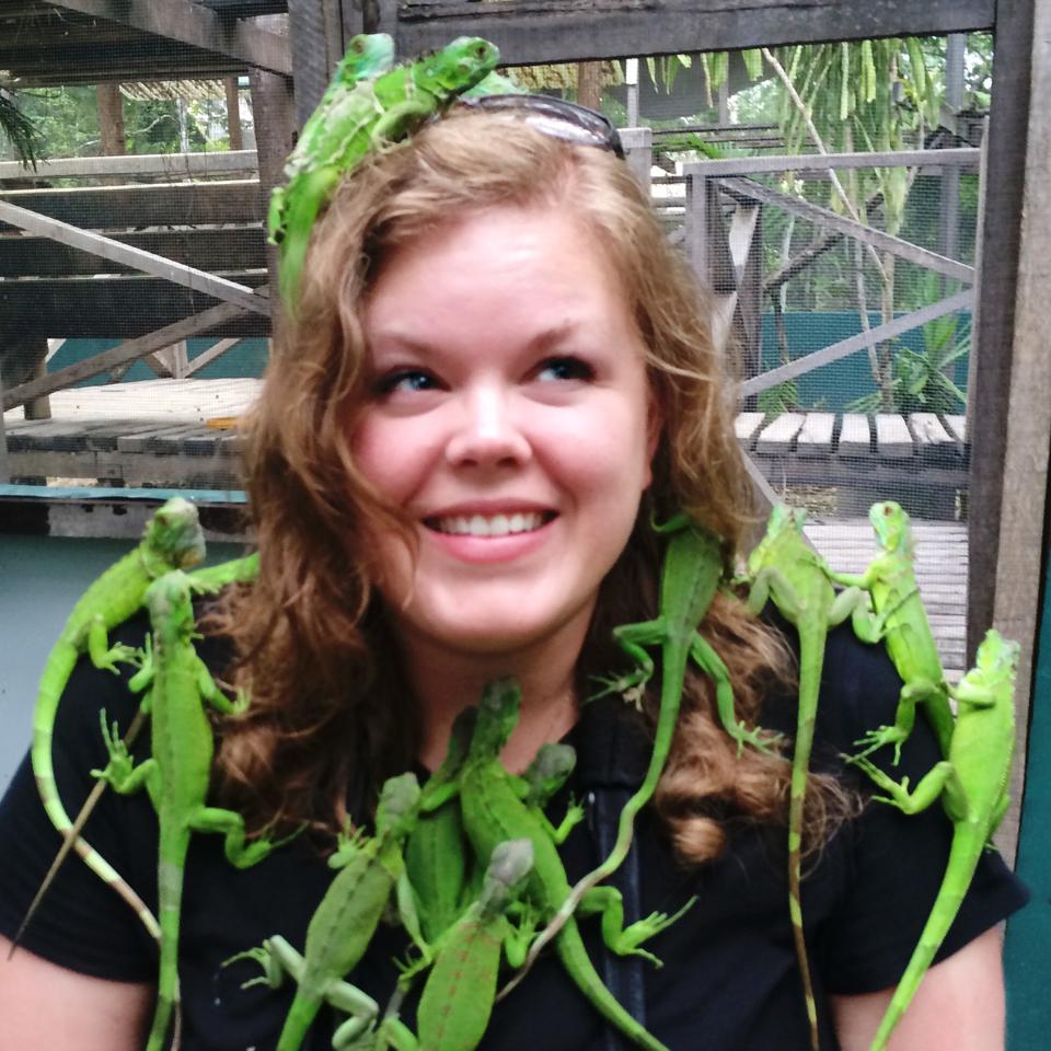 Picture of Megan Nolan covered in iguanas